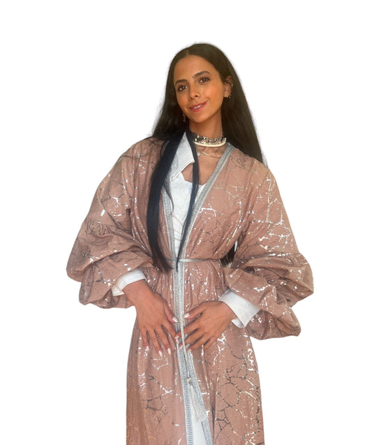 Electric silver kaftan with puffy sleeves.