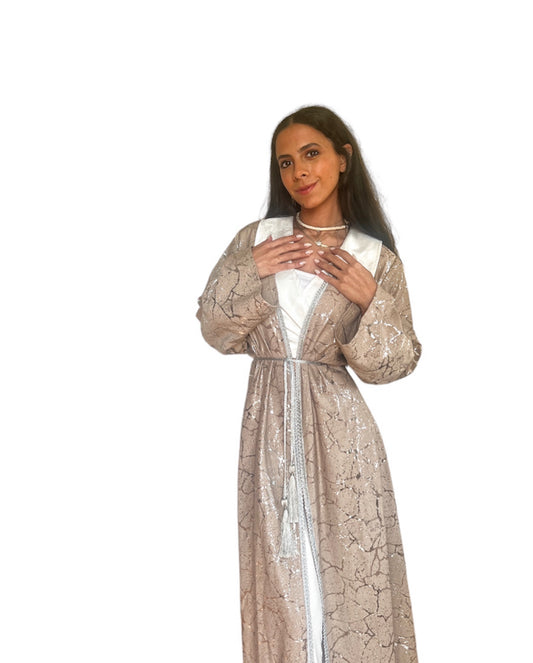 Electric silver kaftan with straight sleeves .